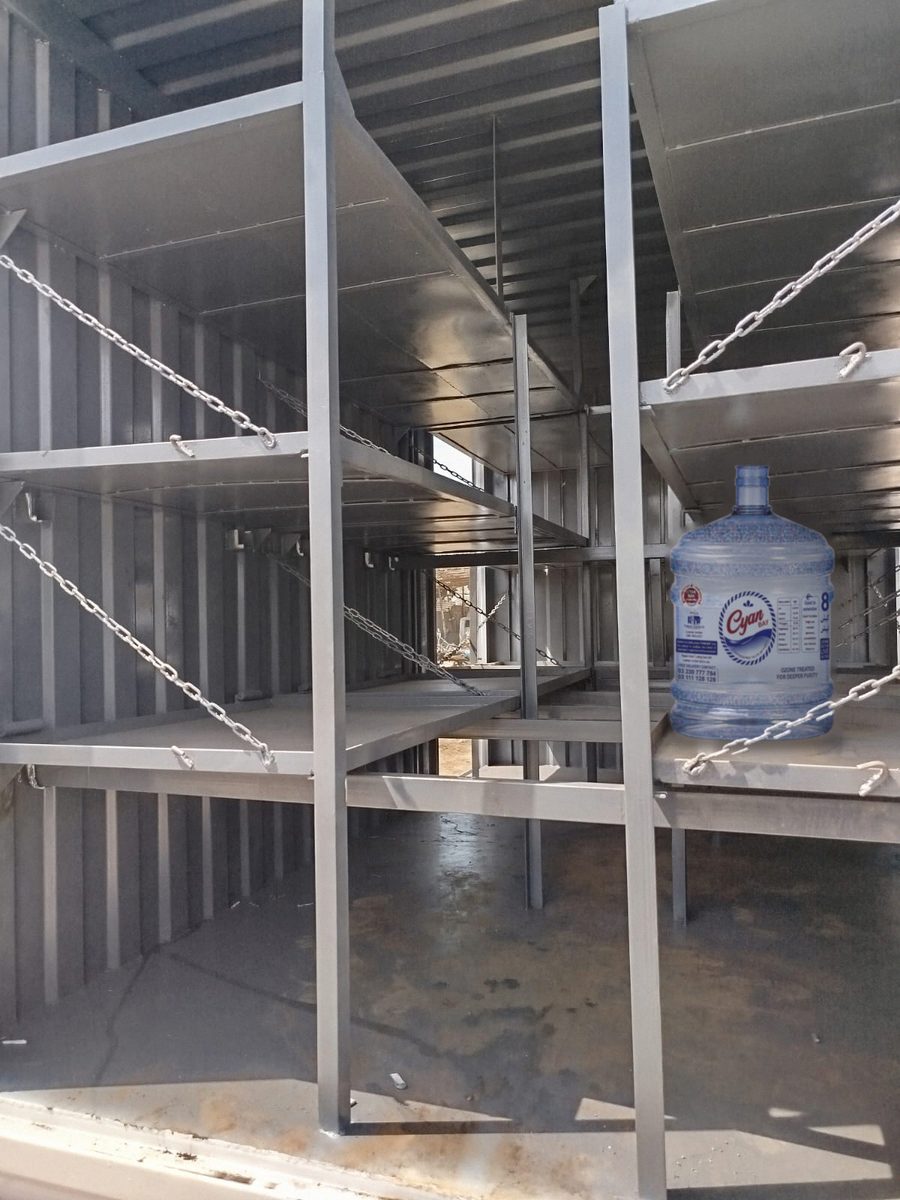 Steel shelves and safety chains inside a Cyan Bay truck